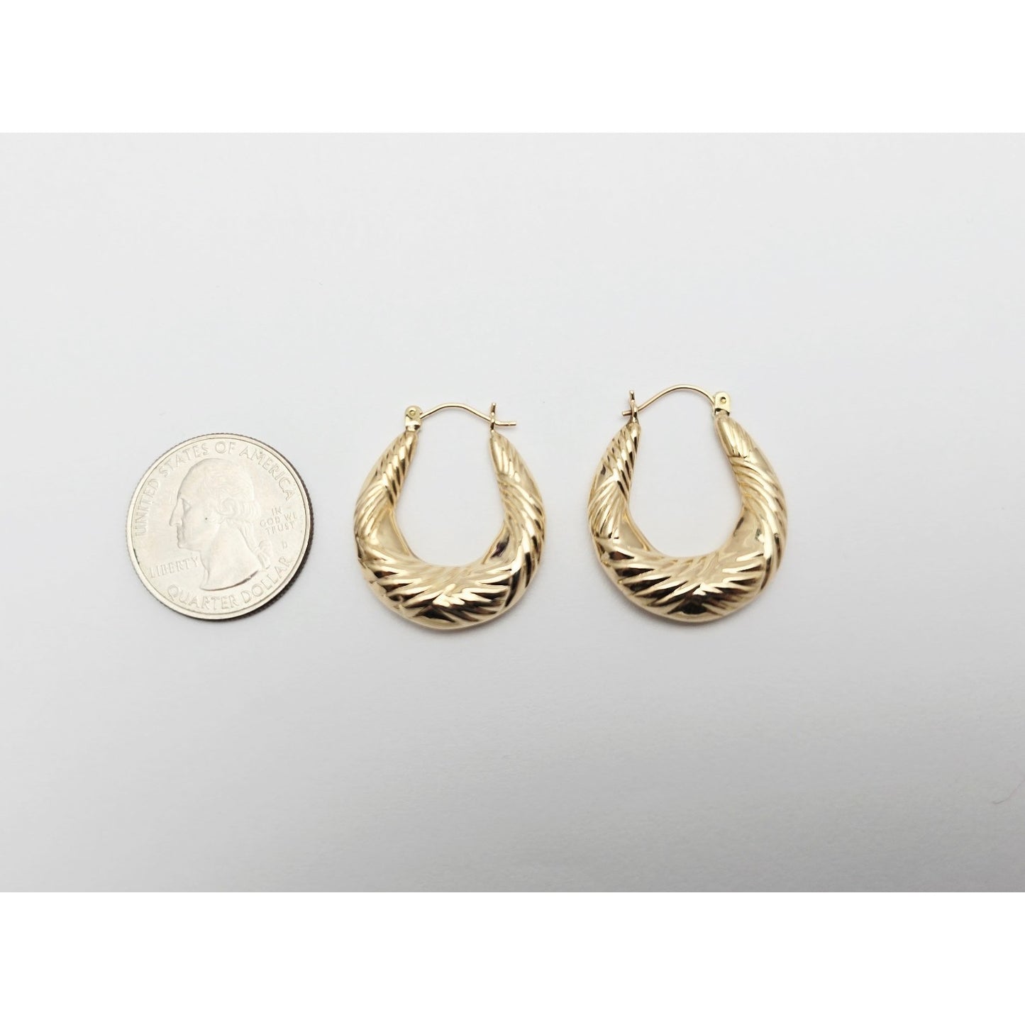 Medium 10K Yellow Gold Tapered Oval Hoop Earrings