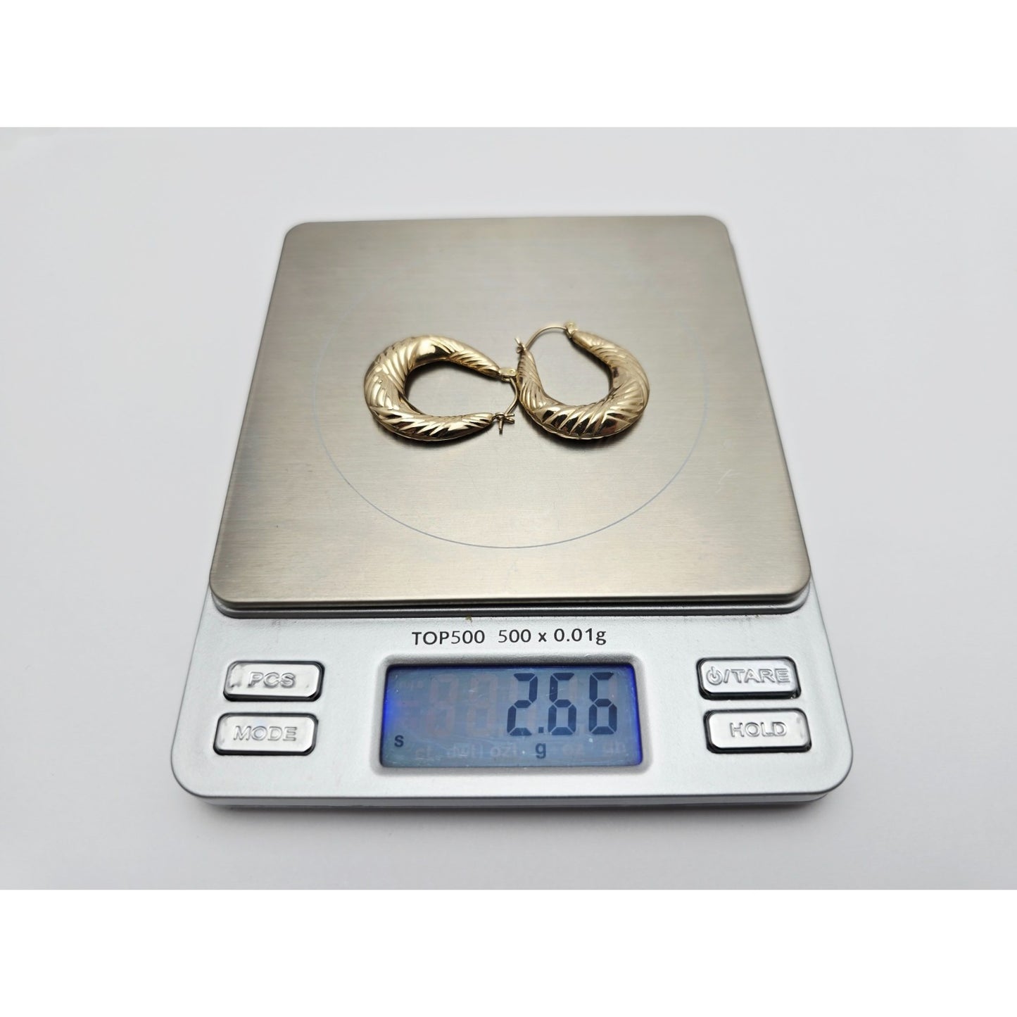 Medium 10K Yellow Gold Tapered Oval Hoop Earrings