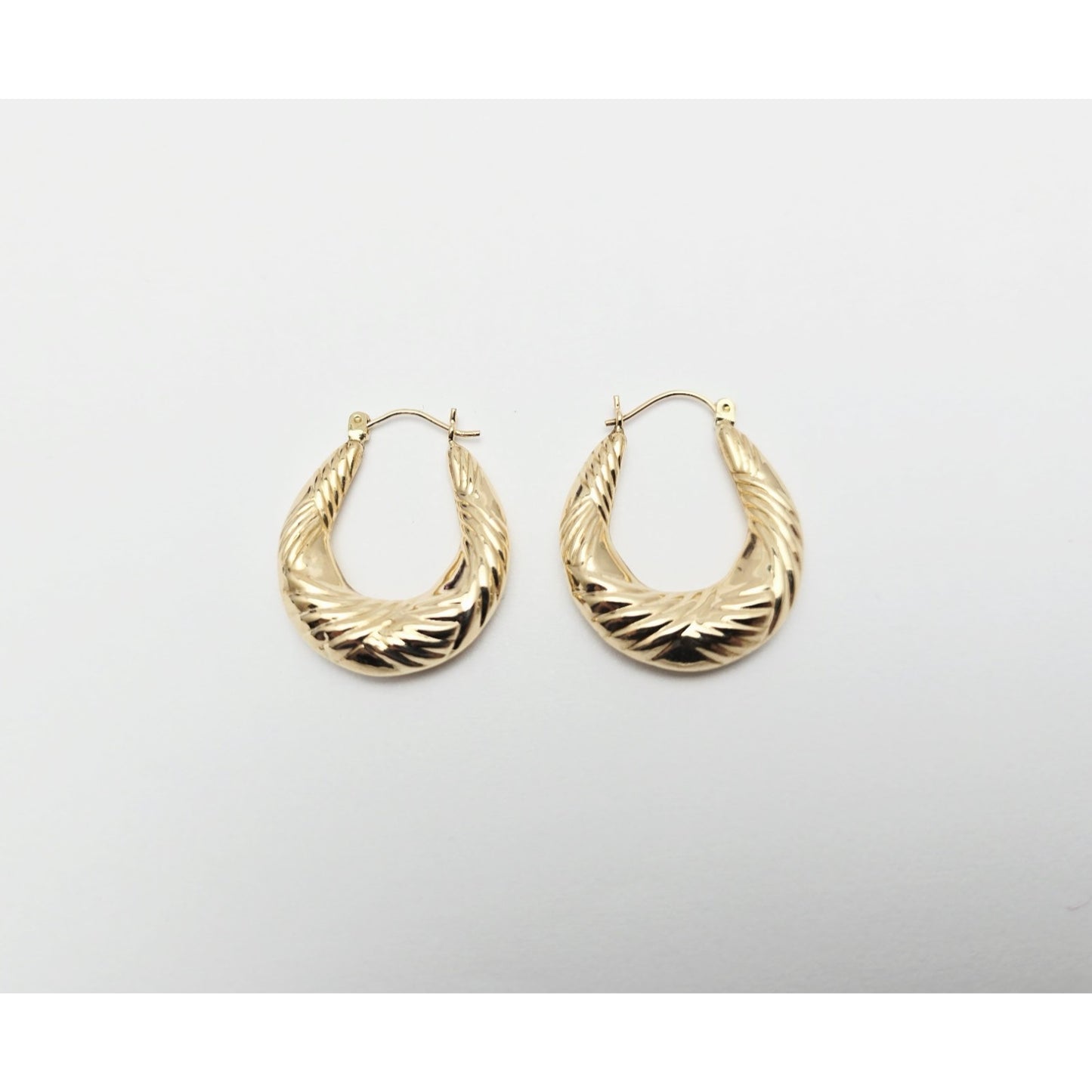 Medium 10K Yellow Gold Tapered Oval Hoop Earrings