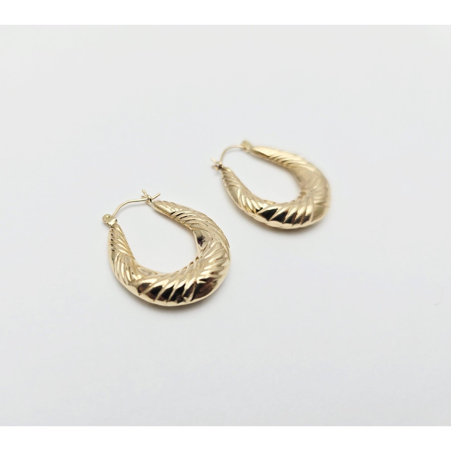 Medium 10K Yellow Gold Tapered Oval Hoop Earrings