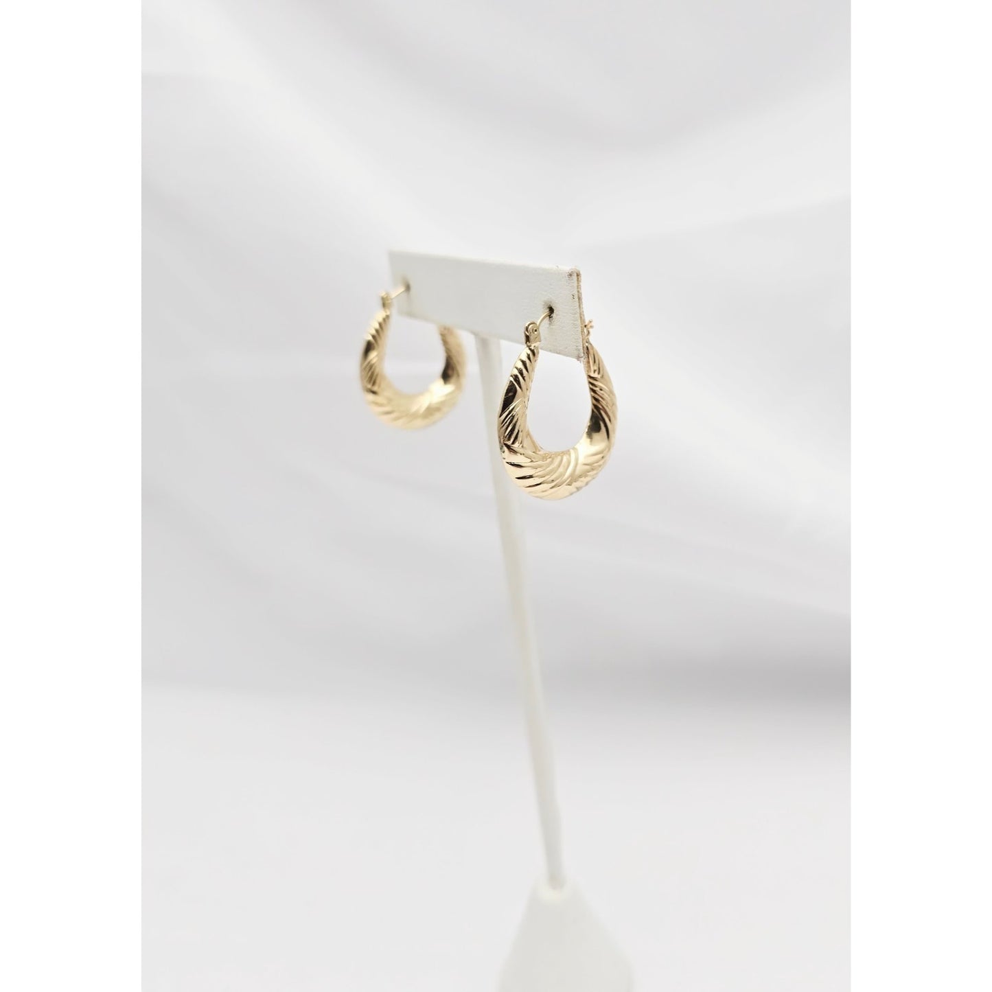 Medium 10K Yellow Gold Tapered Oval Hoop Earrings