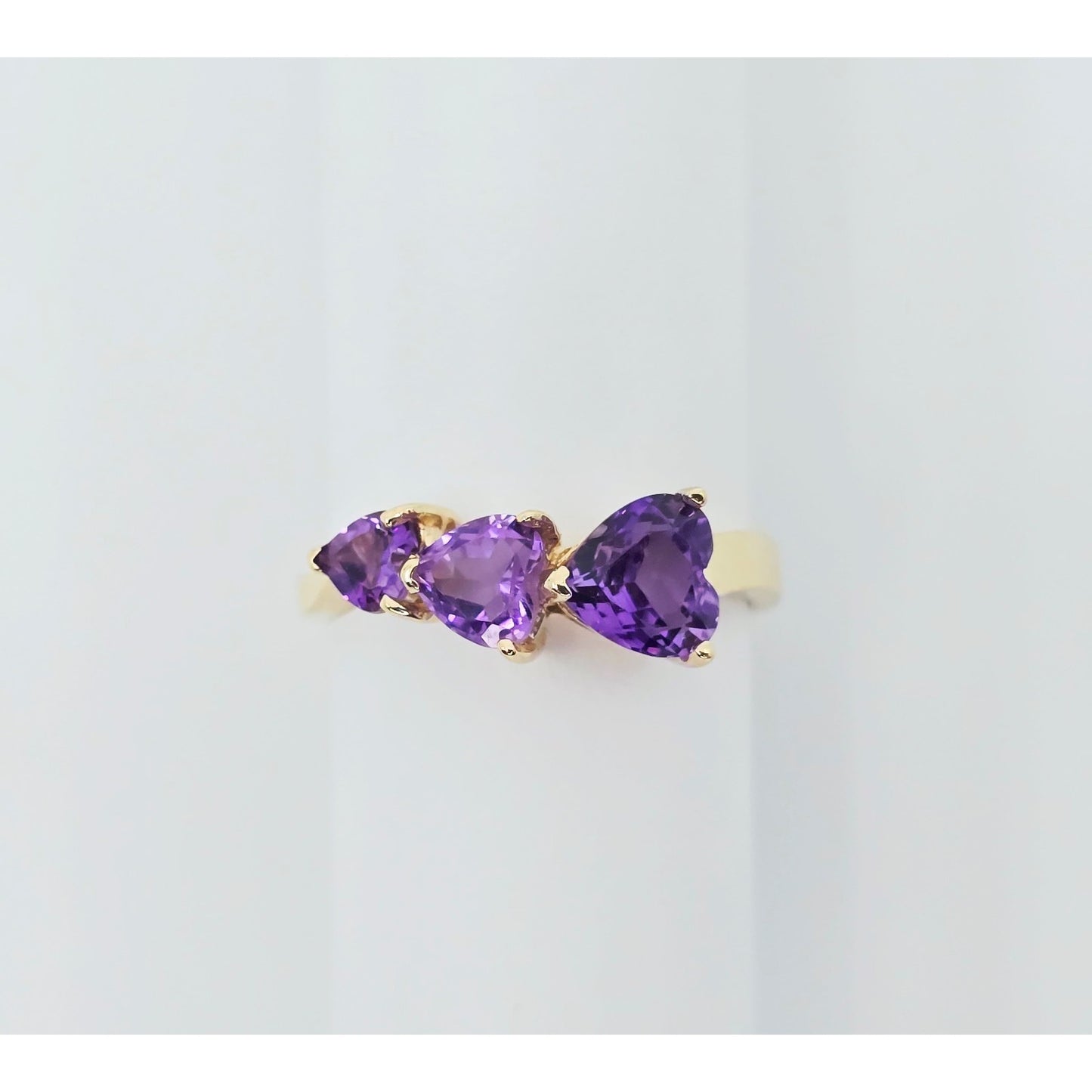 10K Yellow Gold Graduated Heart Shaped Amethyst Ring