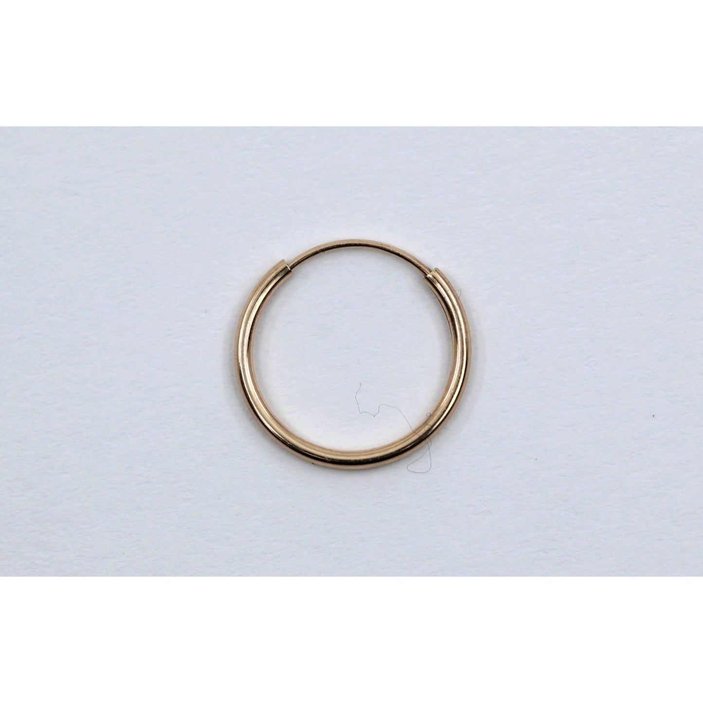 Single Tiny 10K Yellow Gold Hoop Earring