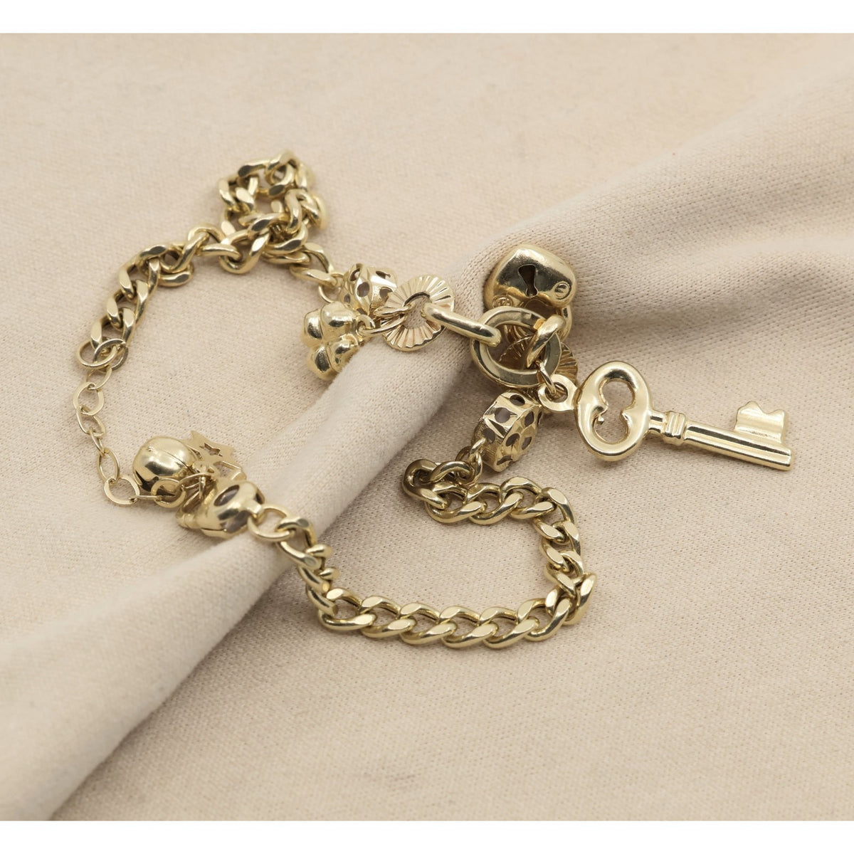14K Yellow Gold Cuban Link Lucky Charm Key, Lock & Clover Resizable Bracelet