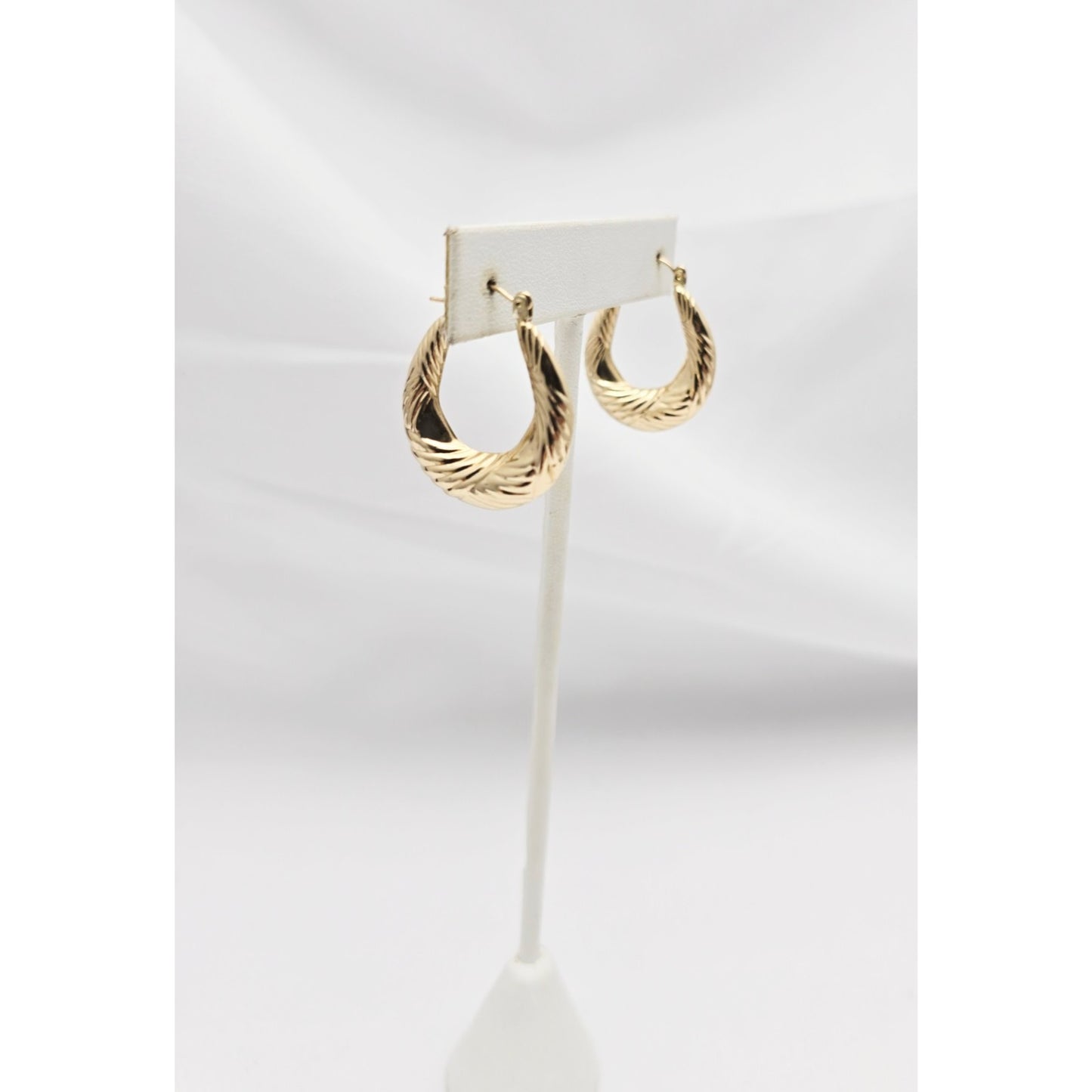 Medium 10K Yellow Gold Tapered Oval Hoop Earrings