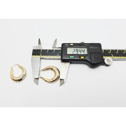 Medium 10K Yellow Gold Tapered Oval Hoop Earrings