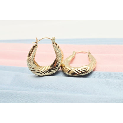 Medium 10K Yellow Gold Tapered Oval Hoop Earrings