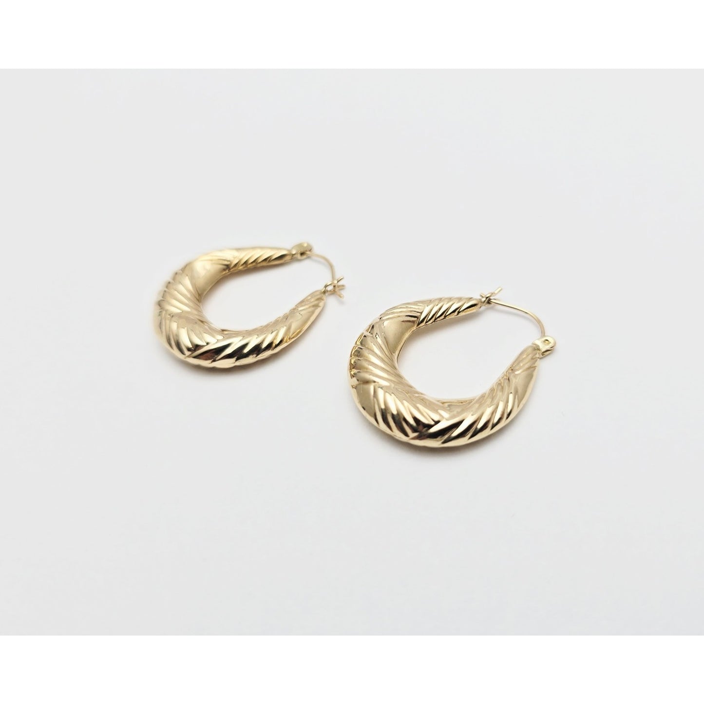 Medium 10K Yellow Gold Tapered Oval Hoop Earrings